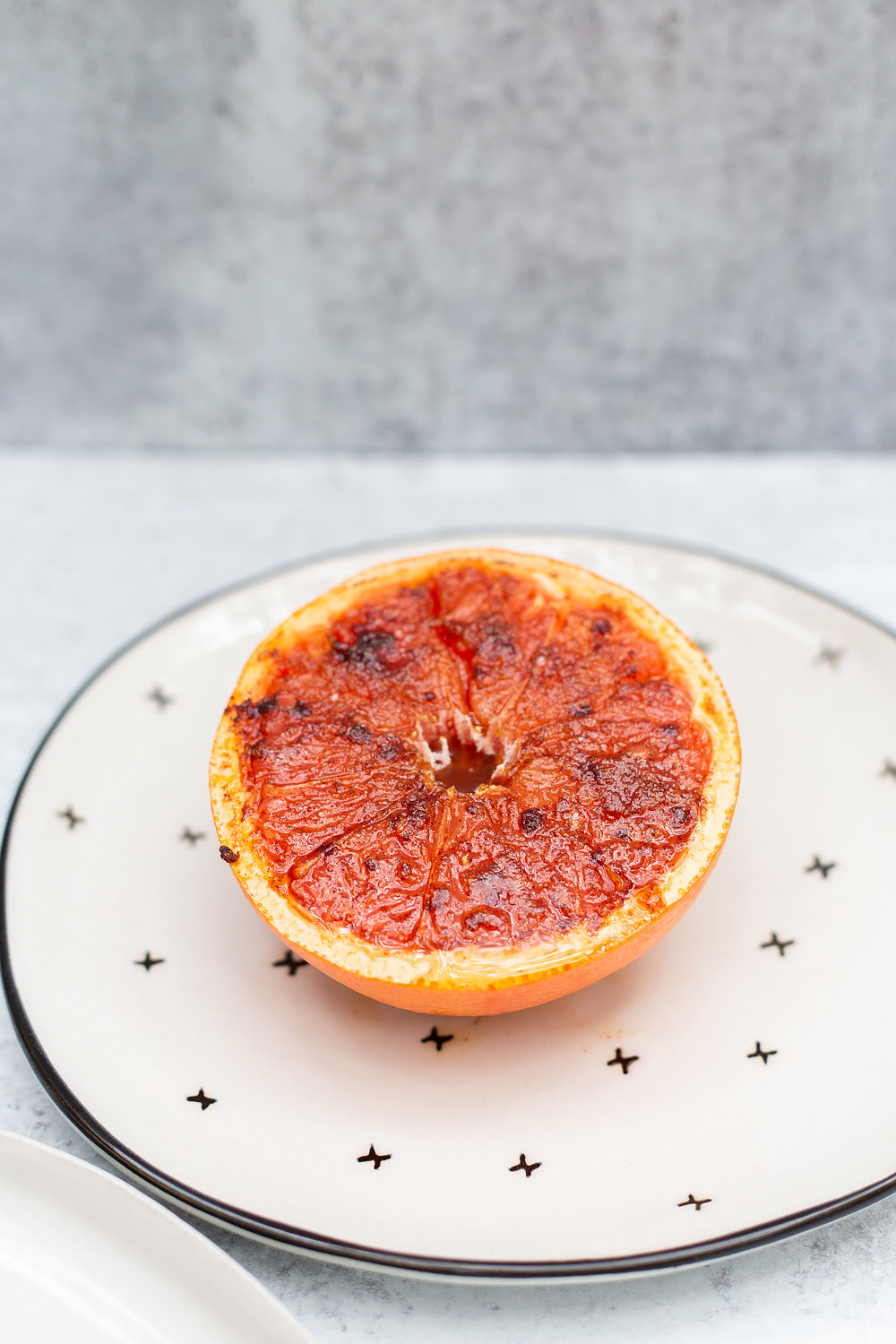 broiled grapefruit on a plate