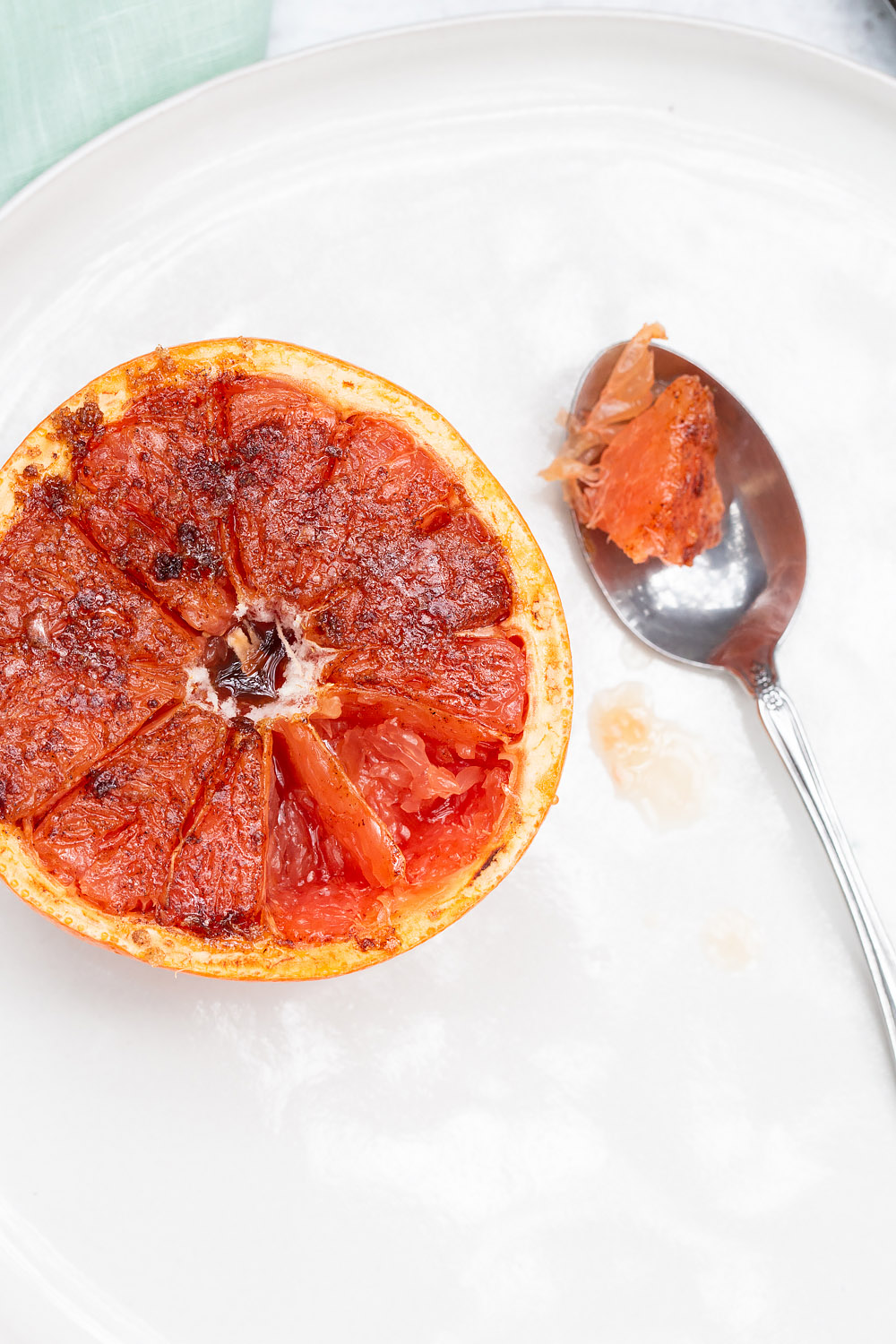 broiled grapefruit with some on a spoon