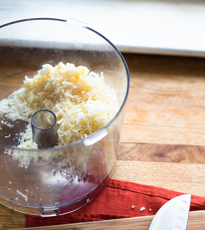 Shredded parmesan cheese in a food processor.