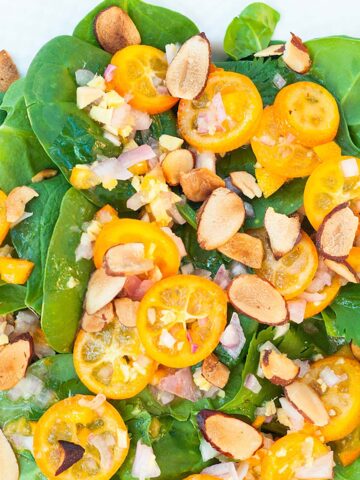 Kumquat salad with chopped almonds.