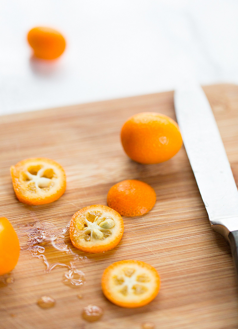 kumquats up close on a cutting board