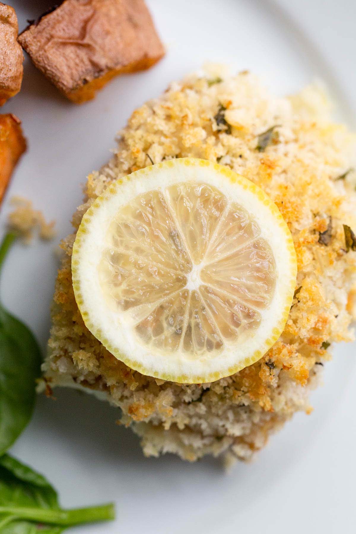 Panko parmesan cod with a lemon slice.