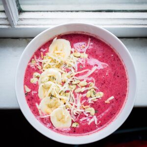 Berry smoothie bowl on a windowsill