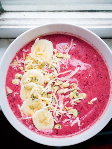 Berry smoothie bowl on a windowsill