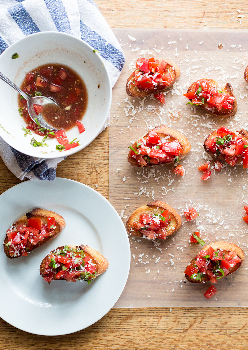tomato bruschetta with freshly grated parmesan cheese on top
