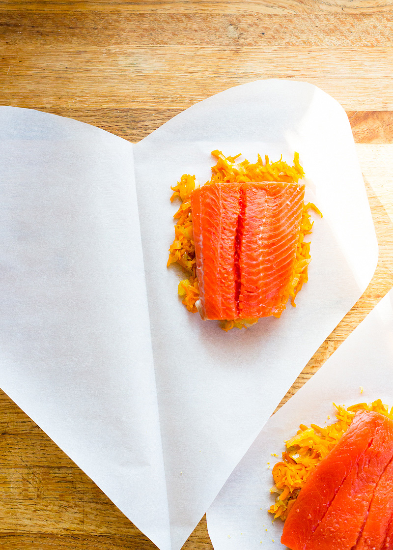 uncooked salmon in parchment paper hearts