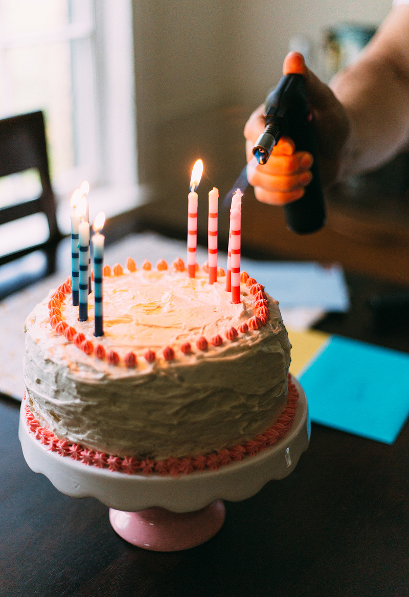 Using a creme brulee torch to light birthday candles.