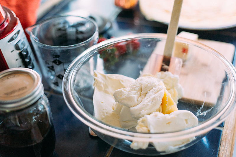 mixing together cheeses for blintzes