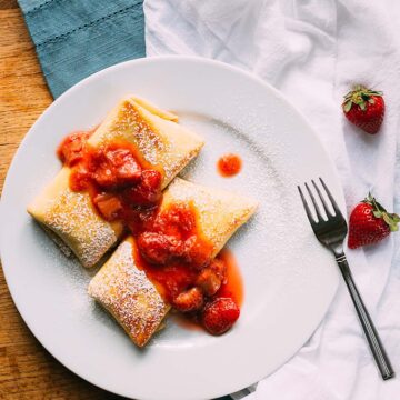 strawberry rhubarb blintzes on a plate