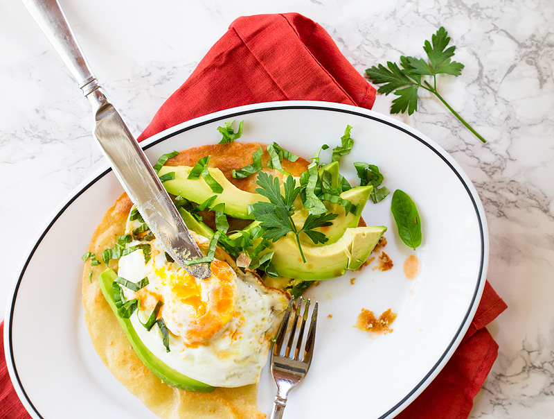 breakfast tostada with avocado and egg