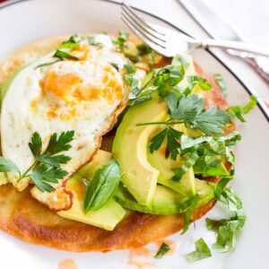 Breakfast tostada on a plate.