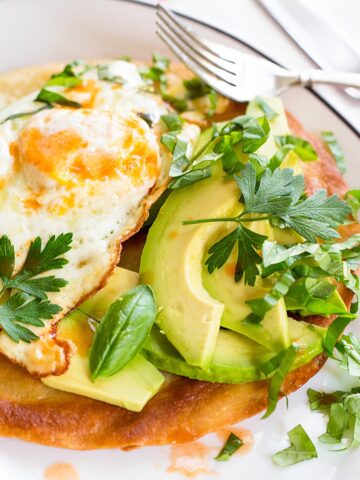 Breakfast tostada on a plate.