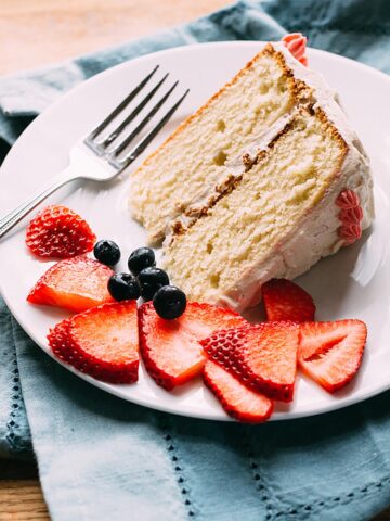 Vanilla bean birthday cake with fresh strawberries and blueberries.