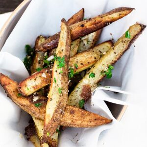 Oven baked fries topped with minced garlic and fresh parsley.