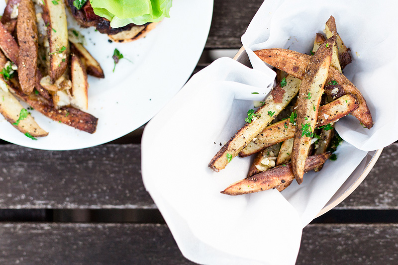 oven baked fries topped with parsley and garlic