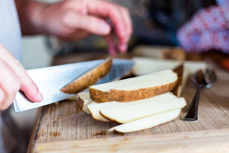 slicing a potato