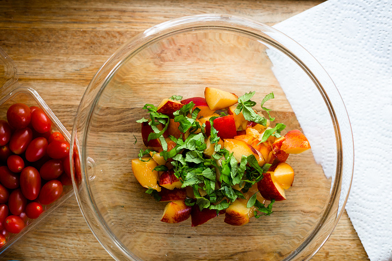 peaches and basil in a bowl