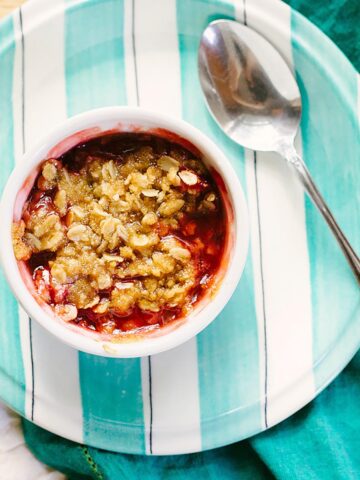 Strawberry crumble in a ramekin.