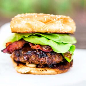 Hamburger with lettuce and bacon.