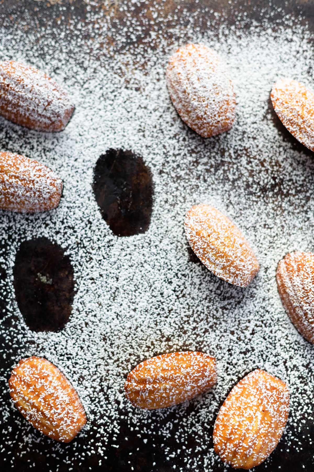 lemon madeleines dusted with powdered sugar