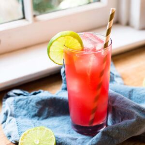 Watermelon agua fresca with a lime wheel.