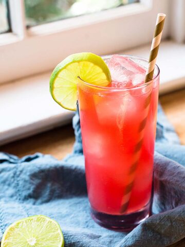 Watermelon agua fresca with a lime wheel.