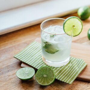 Caipirinha with a lime wedge.