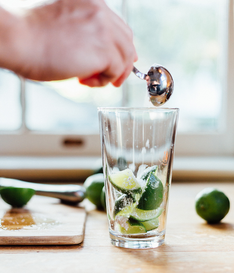 limes in a glass for a brazilian caipirinha