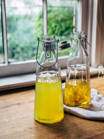 making homemade limoncello - two bottles in process.