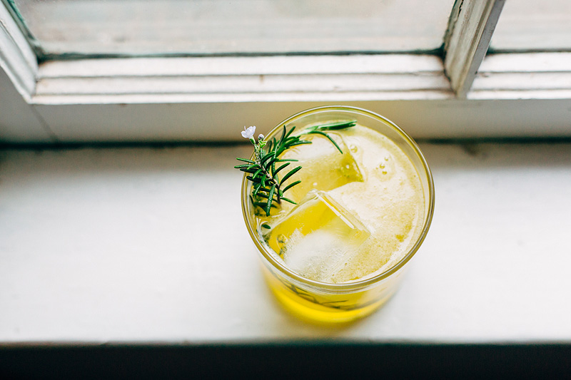 rosemary bees knees cocktail on a windowsill