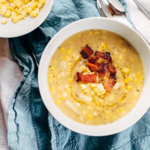 Corn chowder topped with bacon.