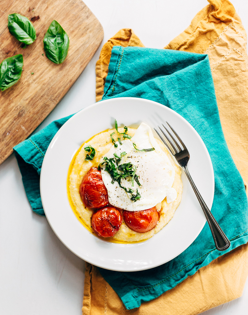 breakfast polenta with tomatoes topped with fresh basil