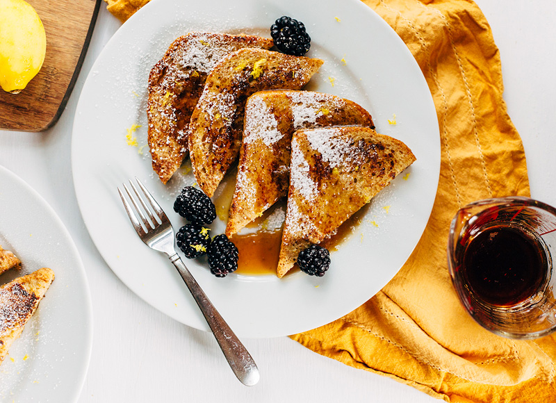 french toast for two with lemon zest and blackberries