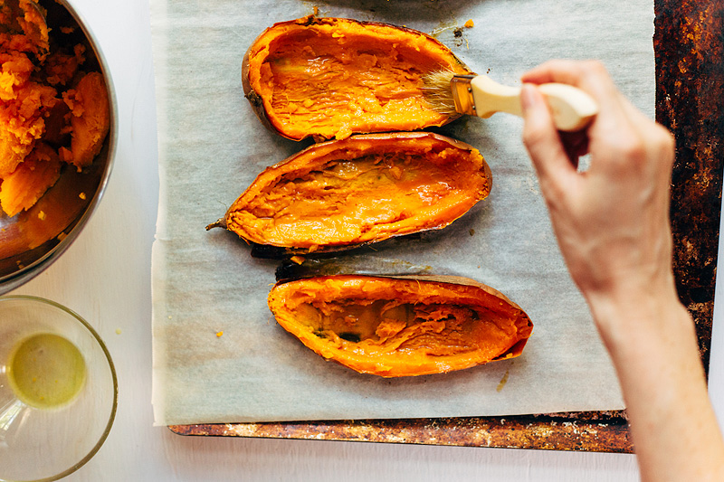 brushing sweet potato skins with olive oil