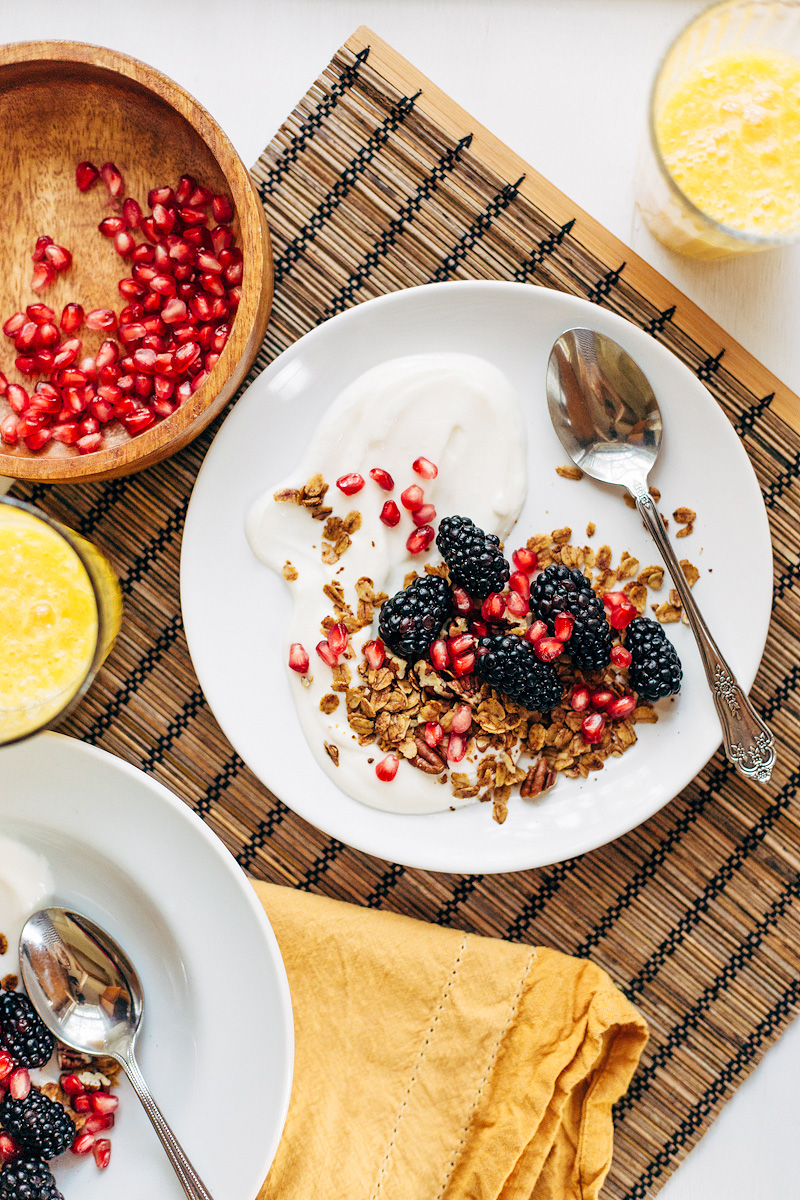 yogurt topped with granola and fresh fruit