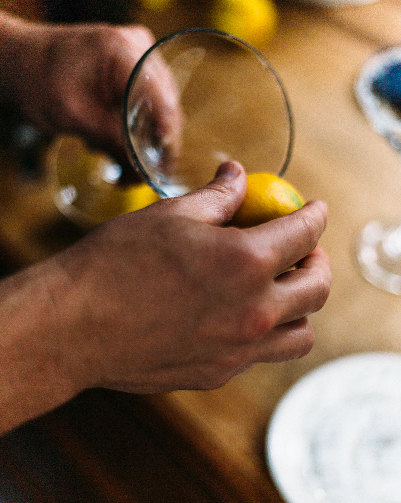 running a lemon around the rim of a martini glass