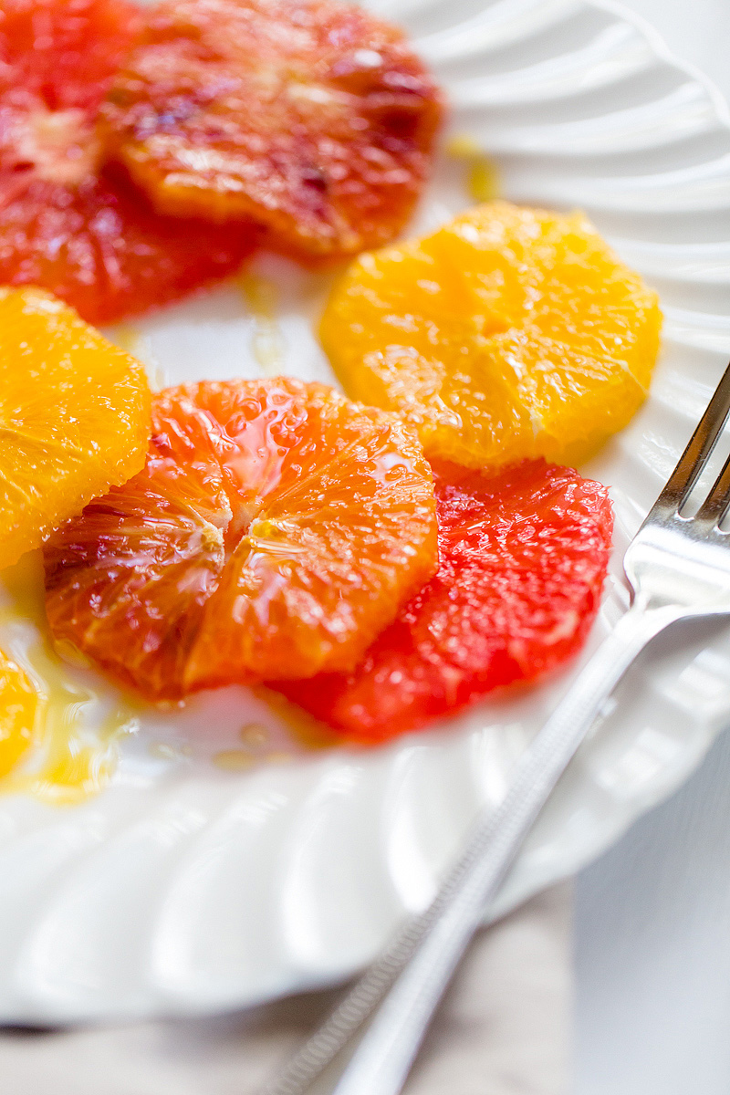 winter citrus salad up close with olive oil and honey