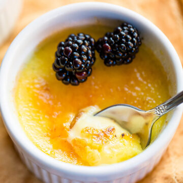 Vanilla bean creme brulee with blackberries