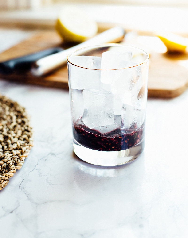 smashed blackberries in a glass