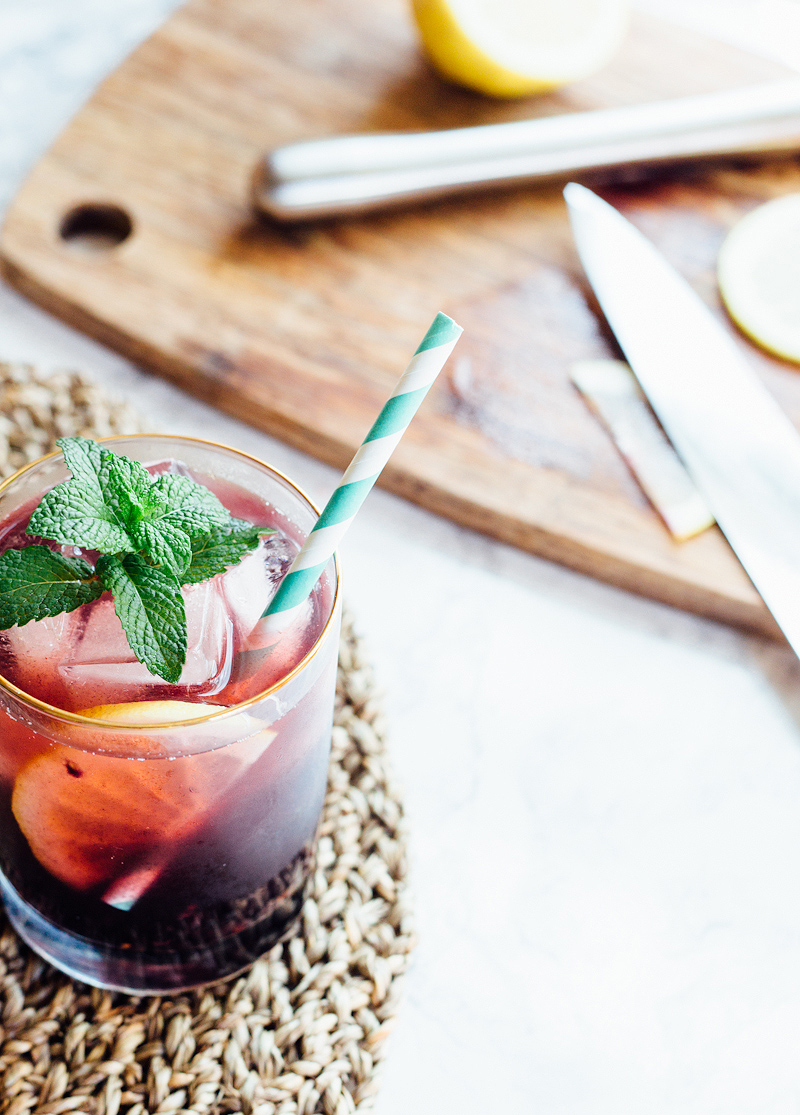 Blackberry Iced Tea with Mint and a straw