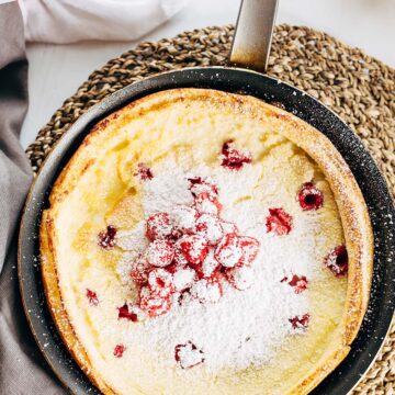 Raspberry dutch baby with powdered sugar