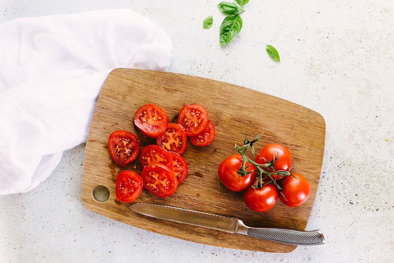 tomatoes on a cutting board.