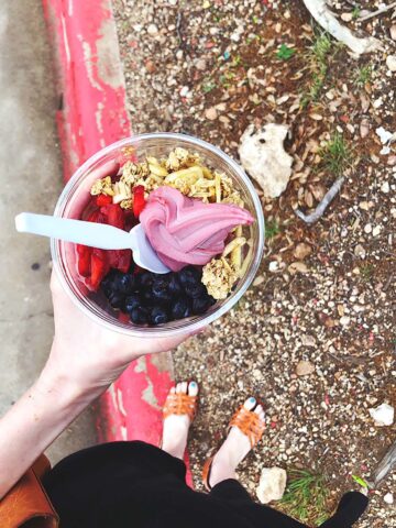 Holding an acai bowl