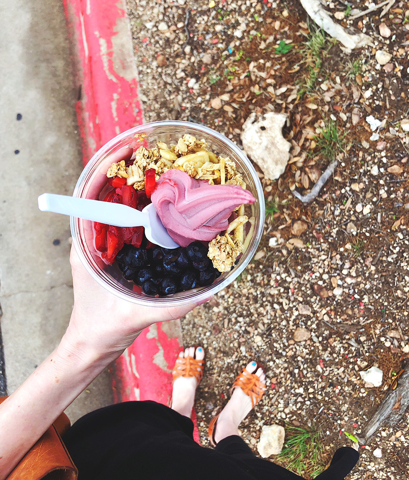 holding an acai bowl at costco