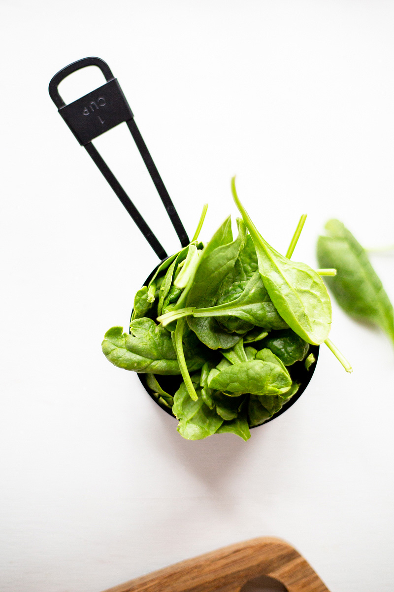 Spinach in a measuring cup