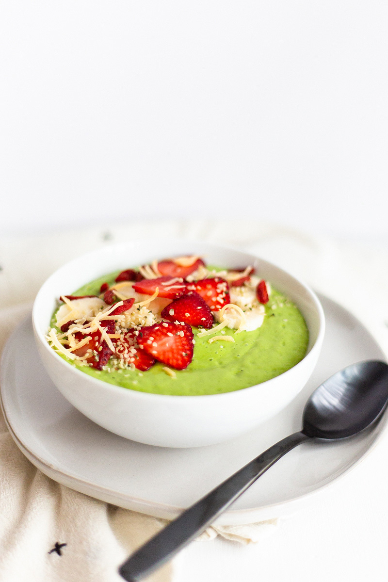 Creamy Green Smoothie Bowl with a black spoon