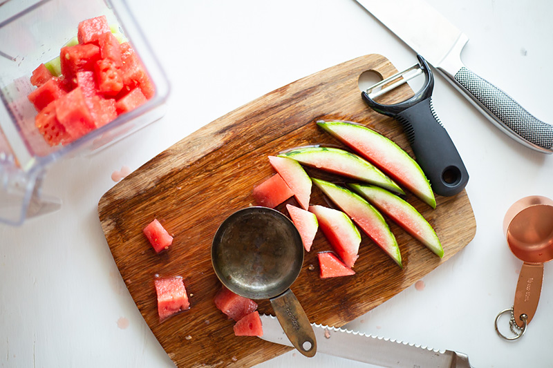 sliced and cubed watermelon on a cutting board