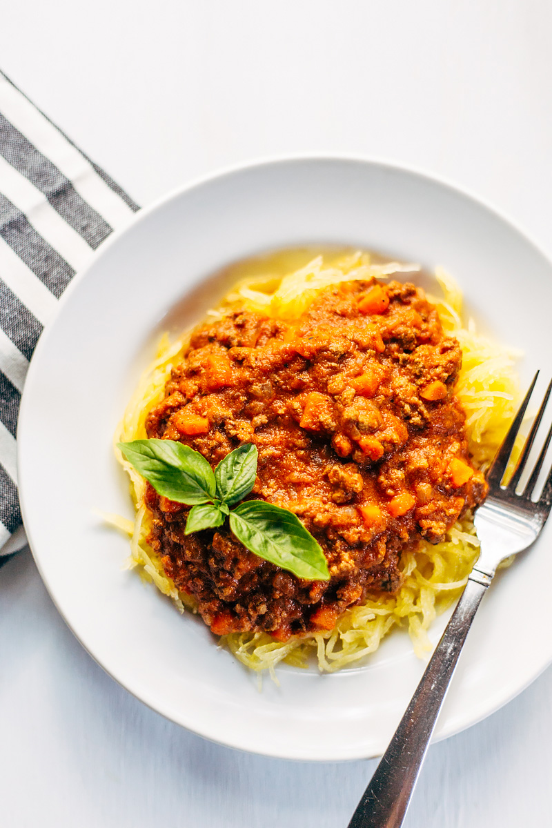 bolognese sauce over spaghetti squash topped with basil