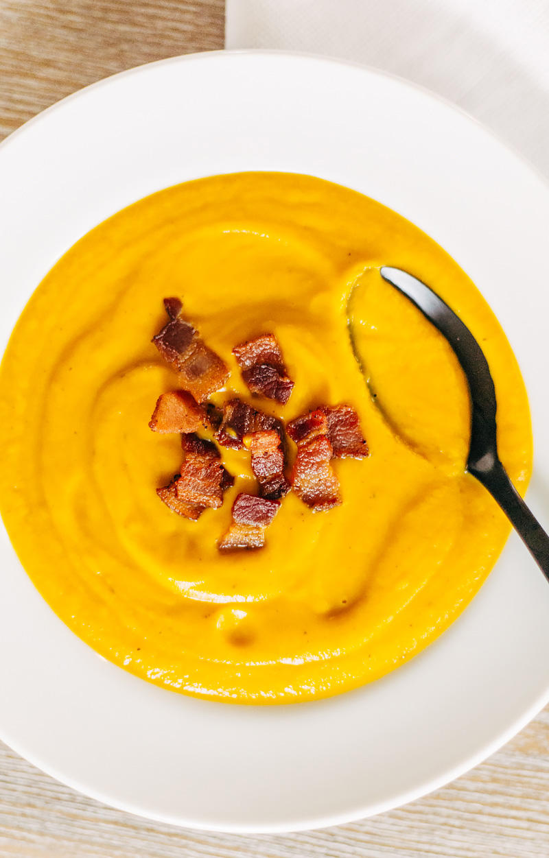 roasted butternut squash soup in a bowl with a spoon