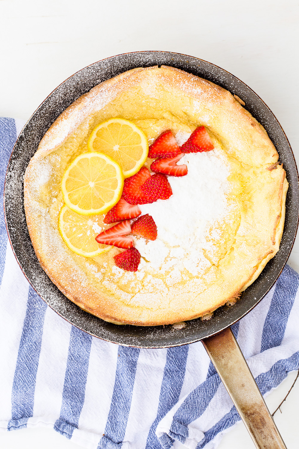 Lemon Dutch Baby Pancake with Powered Sugar and Strawberries